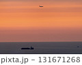 夕焼け空に船と飛行機 131671268
