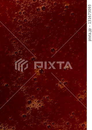Red liquid texture with bubbles, abstract macro background 131673093