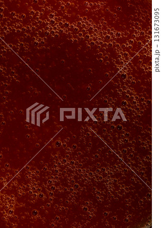 Red liquid texture with bubbles, abstract macro background 131673095
