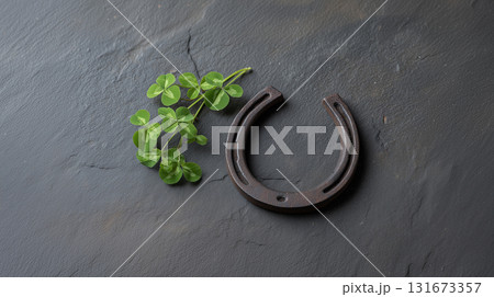 Vintage Iron Horseshoe with Fresh Shamrock on Black Slate for St Patricks Day Vintage Iron Horseshoe with Fresh Shamrock on Black Slate for St Patricks Day 131673357