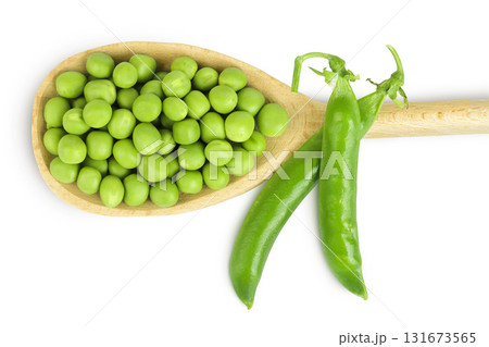 Fresh green peas in wooden spoon isolated on white background. Top view. Flat lay Fresh green peas in wooden spoon isolated on white background. Top view. Flat lay 131673565