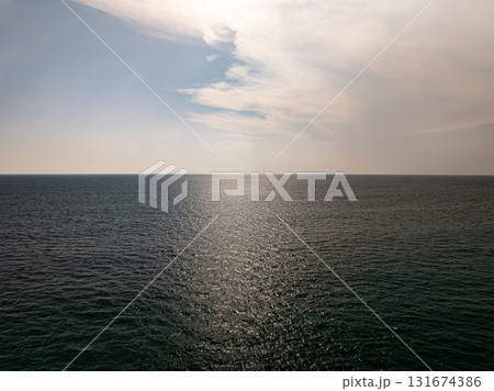 Beautiful sky sunset or sunrise clouds over sea nature background Beautiful sky sunset or sunrise clouds over sea nature background 131674386