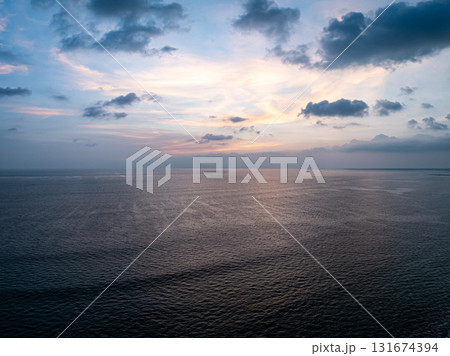 Beautiful sky sunset or sunrise clouds over sea nature background 131674394