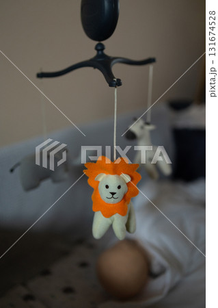 Baby Animal Mobile Hanging Over Crib With Lion, Elephant and Giraffe Baby Animal Mobile Hanging Over Crib With Lion, Elephant and Giraffe 131674528