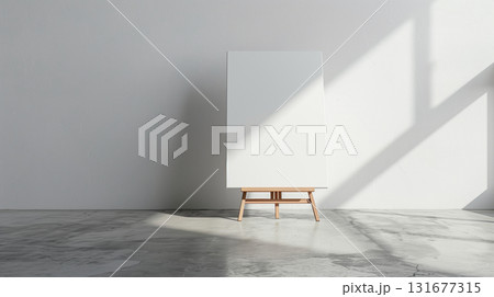 Front view Single one easel with white empty blank canvas in interior of exhibition studio or artist workshop. . Mock up for artwork image, paint creative space. 131677315