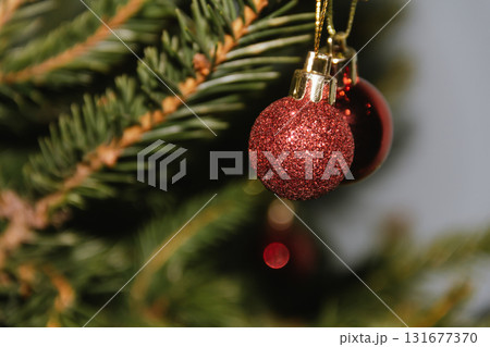 Beautiful Christmas defocused blurred background with Christmas tree lights in the evening. Festive New Year's mood, flash photography, retro modern style 131677370