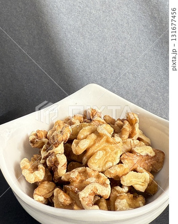 Peeled walnuts in a bowl. Closeup of walnuts in bowl. 131677456