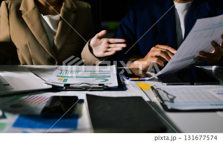 business people in meeting discussing plans together business people in meeting discussing plans together 131677574