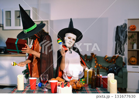 People having fun at Halloween party People having fun at Halloween party 131677630