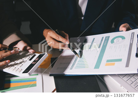 Business Team Analyzing Financial Data in Modern Office 131677657