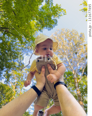 Joyful Baby Lifted in Forest Joyful Baby Lifted in Forest 131677895