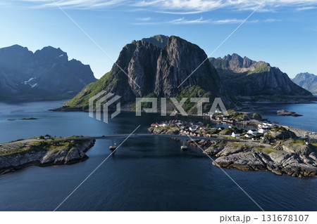 Reine village with bridge and mountains in lofoten, norway Reine village with bridge and mountains in lofoten, norway 131678107