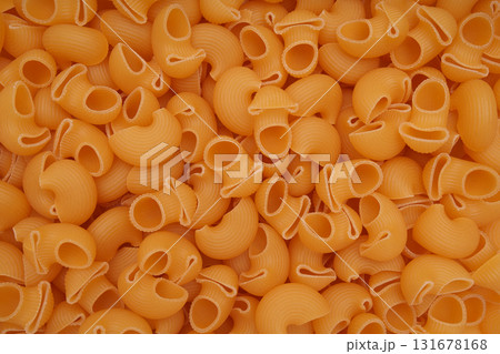 Raw pasta close-up, bright golden hue. Raw pasta close-up, bright golden hue. 131678168