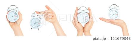 Set of human hands holding white alarm clock isolated on transparent background Set of human hands holding white alarm clock isolated on transparent background 131679048