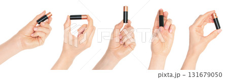 Set of human hands holding battery isolated on transparent background 131679050