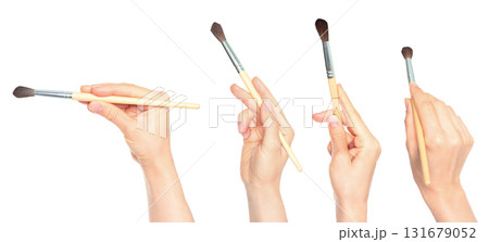 Set of human hands holding paintbrush isolated on transparent background 131679052