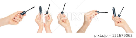 Set of human hands holding eyelash mascara and brush isolated on transparent background. Set of human hands holding eyelash mascara and brush isolated on transparent background. 131679062