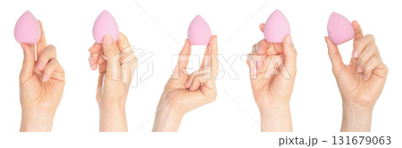 Set of human hands holding cosmetic sponge isolated on transparent background 131679063