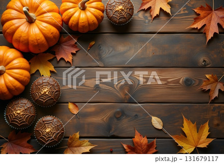 autumn dark wooden background with muffins and pumpkins autumn dark wooden background with muffins and pumpkins 131679117