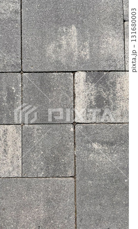 Freshly cut grass piled in sunlight at a garden in summer, showcasing vibrant green colors and texture 131680003