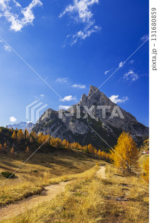 Dolomites mountains view with golden larch in Cortina d'Ampezzo, Italy 131680859