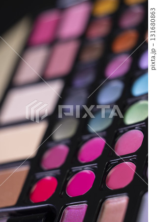 Cosmetic palette showing various makeup products and colors 131680863