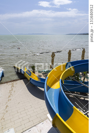 Colorful water slides ending in lake Balaton at Paloznak Colorful water slides ending in lake Balaton at Paloznak 131680912