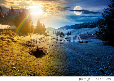beautiful mountain landscape on autumn equinox. day and night time change concept. coniferous forest in natural park. rural valley with pastures on hills with sun and moon. amazing countryside 131680969