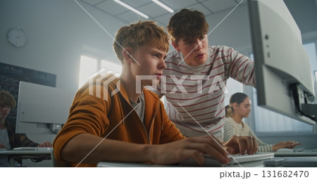 Young Man Seeks Advice on Programming During University Lesson 131682470