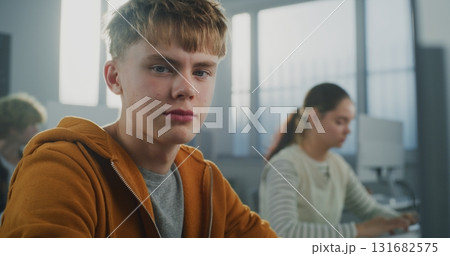 Handsome Student Works on Developing Game in Classroom 131682575