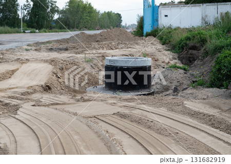 Construction site showing wastewater management system installation in a sandy trench Construction site showing wastewater management system installation in a sandy trench 131682919