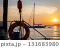 Sailboat on the sea by sunset 131683980