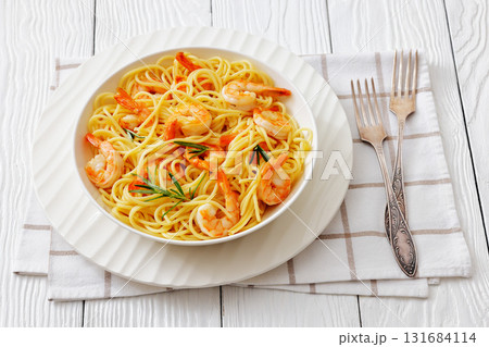 yummy spaghetti with shrimps in a white bowl yummy spaghetti with shrimps in a white bowl 131684114