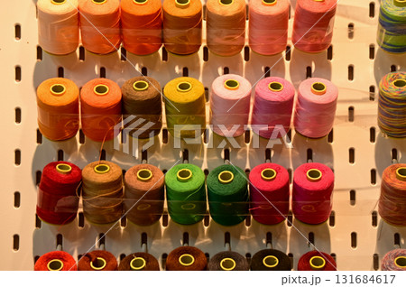 Close up view of a set of sewing threads. Multi-colored thread. For background use. Close up view of a set of sewing threads. Multi-colored thread. For background use. 131684617