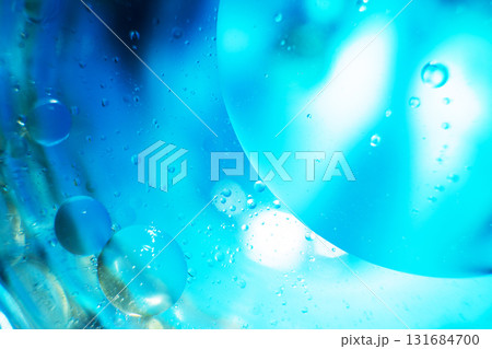 Oil bubbles close up. circles of water macro. abstract light blue background Oil bubbles close up. circles of water macro. abstract light blue background 131684700