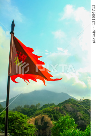 Close up of the traditional Chinese ancient style flag in the rural. Using it during the war, for identify which side. Translation: Spring and Autumn Period. 131684713