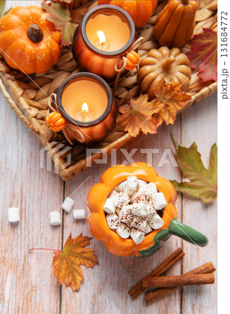 Cozy autumn arrangement with hot chocolate and candles 131684772
