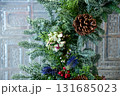 Close-up of the Christmas floral wreaths. Festive and home decoration. Winter season, winter festive. Christmas celebration, Xmas celebration. For background use. 131685023