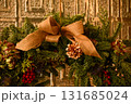 Close-up of the Christmas floral wreaths. Festive and home decoration. Winter season, winter festive. Christmas celebration, Xmas celebration. For background use. 131685024