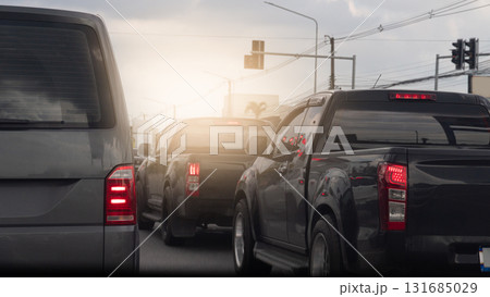 Rear side of van car and turn on brake light. Cars in traffic jam on the road in rush hour. Stop from traffic red light control in the junction. Blurred background of car in the city. 131685029