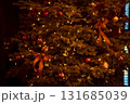 Close-up of the present boxes under the Christmas trees with colorful ornaments. Christmas presents, gifts. Festive decoration. Winter season, winter festive. Xmas celebration. For background use. 131685039
