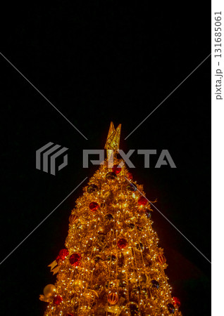 Close-up of the Christmas trees with colorful ornaments. Festive decoration. Full of ornaments. Winter season, winter festive. Christmas celebration, Xmas celebration. For background use. 131685061