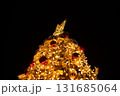 Close-up of the Christmas trees with colorful ornaments. Festive decoration. Full of ornaments. Winter season, winter festive. Christmas celebration, Xmas celebration. For background use. 131685064
