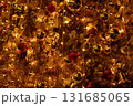 Close-up of the Christmas trees with colorful ornaments. Festive decoration. Full of ornaments. Winter season, winter festive. Christmas celebration, Xmas celebration. For background use. 131685065