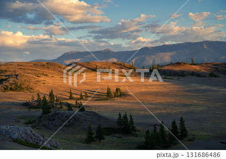 Sunset Over Serene Mountain Landscape In Altai Mountains Sunset Over Serene Mountain Landscape In Altai Mountains 131686486