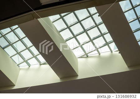 Abstract, minimalist, modern architectural space with concrete walls and opening skylight 131686932
