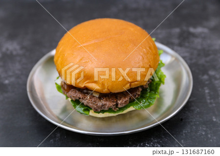 beef patty hamburger on a plate 131687160