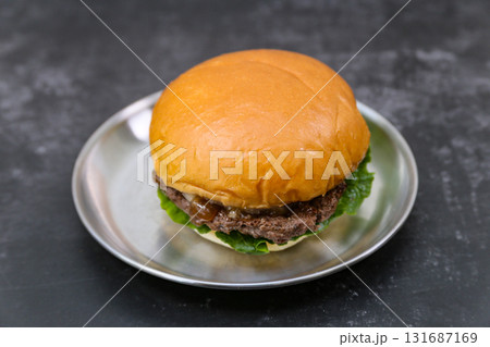 beef patty hamburger on a plate beef patty hamburger on a plate 131687169