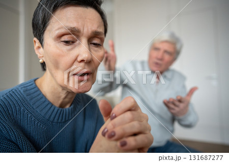Depressed exhausted woman in silent protest against angry husband. Unhappiness, conflict stress 131687277