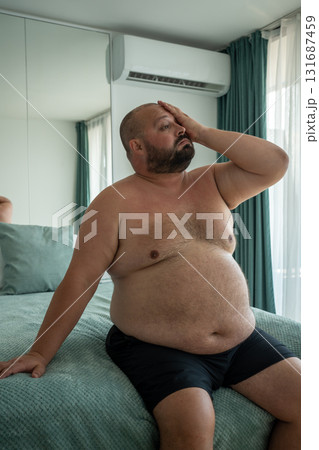 Fat guy suffers tortures from excessive sweating heat stuffiness summer abnormally high temperatures Fat guy suffers tortures from excessive sweating heat stuffiness summer abnormally high temperatures 131687459